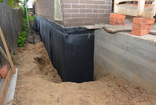 Happy homeowners after waterproofing job in Pinckney